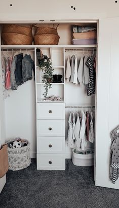 an organized closet with clothes and baskets