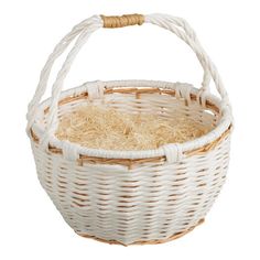 a white wicker basket filled with hay