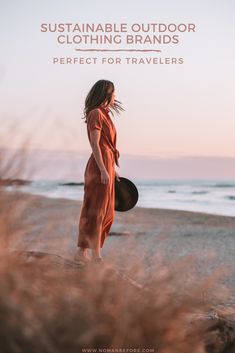 a woman standing on top of a beach next to the ocean with text overlay that reads, sustainable outdoor clothing brands perfect for travelers