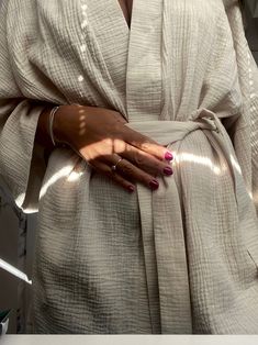 This bathrobe was designed for women who value comfort and love natural fabrics. Cotton kimono made of muslin will warm you in winter and cool you in summer. The fabric is wonderfully soft. I wanted the robe to act as a dress, so you can wear it all day. In one product, I combined several functions to help build a conscious wardrobe. One size kimono Rose-colored kimono GOTS certified natural cotton kimono This bathrobe was created for women who value comfort and love natural fabrics. A cotton ki Bathrobes Aesthetic, Cream Long Sleeve Kimono For Loungewear, Spring Loungewear Kimono With Natural Dye, Cream Summer Robe For Loungewear, Beige Wrap Robe For Spring, Cream Summer Daywear Robe, Spring Beige Wrap Robe, Beige Long Kimono For Daywear, Beige Long Sleeve Kimono For Loungewear