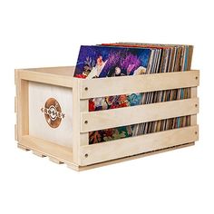 a wooden box with cd's in it on the bottom and inside is filled with cds