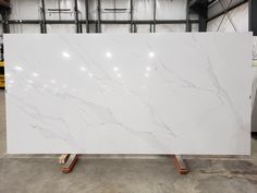 a large white marble slab in a warehouse