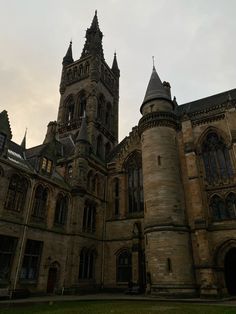 an old building with two towers on top