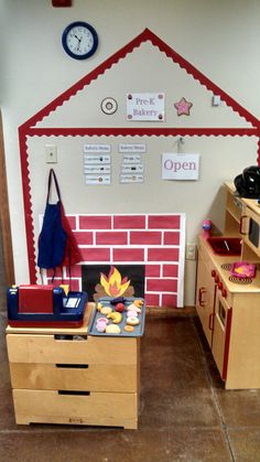 a child's play room with a fire place