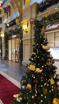 a christmas tree in the middle of a shopping mall