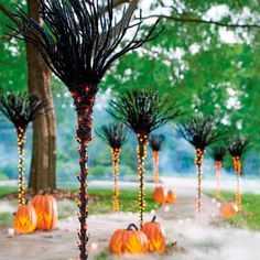 halloween decorations in the shape of trees and pumpkins