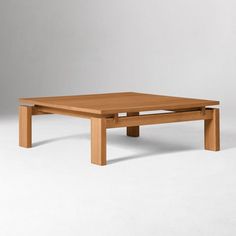 a square wooden table with one leg extended