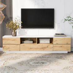 a living room with a large television on the wall