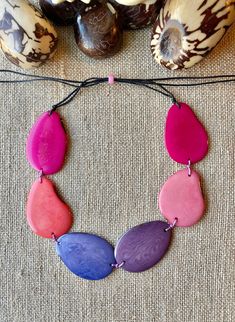 Handmade in Ecuador Necklace Length: Adjustable Length 14 -31 Inches Due to this item being handmade and the nature of the Tagua Nut the size and the color may vary from piece to piece Tagua Nuts, Jade Jewelry, Adjustable Necklace, The Nature, Pink And Purple, Necklace Length, Ecuador, Necklace Etsy, Necklace Lengths