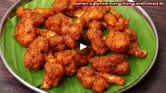 a plate full of fried chicken on a green leaf