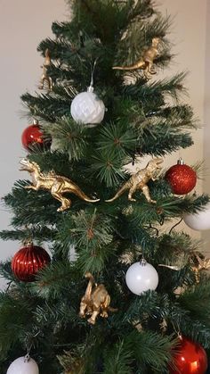 a small christmas tree with ornaments on it