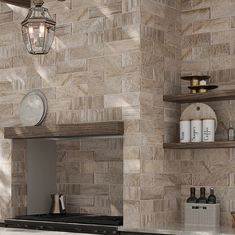 a stove top oven sitting inside of a kitchen next to a wall covered in shelves