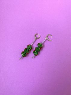 - 2 inches long  - 12 mm gold latch back hoops - size 10 Czech green and red seed beads  - all handmade by me!  - lightweight