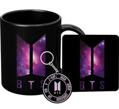 a black mug and keychain with the btob logo on it next to a card holder