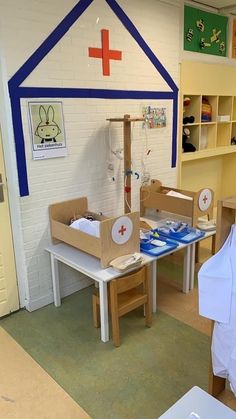 a child's playroom with wooden furniture and toys