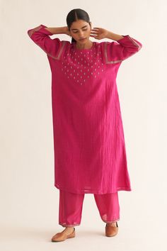 Bright pink chanderi A-line kurta with round neck, floral pattern resham, gold zari hand embroidered yoke and sleeves. Paired with straight fit pants.
Components: 2
Pattern: Hand Embroidered
Type Of Work: Resham and Zari Work
Neckline: Round Neck
Sleeve Type: Three Quarter Sleeves
Fabric: Chanderi
Color: Pink
Other Details: 
Embroidered border on pants
Side slits on kurta
Keyhole back
Kurta Closure: Back loop button
Occasion: Puja - Aza Fashions Pink Suits Women, Kurta And Dupatta, Yellow Kurta, Kurta Pant Set, Designer Kurti Patterns, Beautiful Casual Dresses, Straight Fit Pants, A Line Kurta, Kurti Designs Party Wear