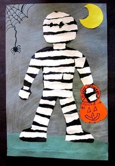 a child's art project made out of paper and yarn with a creepy man holding a pumpkin