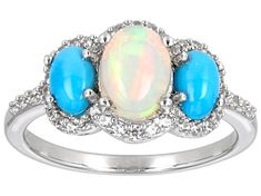 8x6mm Oval White Ethiopian Opal with 6x4mm Oval Blue Sleeping Beauty Turquoise and 0.34ctw Round White Zircon Rhodium Over Sterling Silver Ring. Measures Approximately 0.82"L x 0.43"W. Not Sizeable. Accent Stones Primarily Zircon. Oval Three-stone Opal Ring, Oval Three Stone Opal Ring, Oval Opal Ring With Accent Stones, Oval Three Stone Opal Ring Fine Jewelry, Oval Multi-stone Gemstones For Promise Rings, Oval Three Stone Opal Ring For Anniversary, Turquoise Oval Opal Wedding Ring, Oval Opal Ring With Gemstone Accents For Anniversary, Turquoise Oval Cabochon Opal Ring