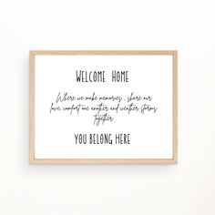 a framed sign with the words welcome home on it