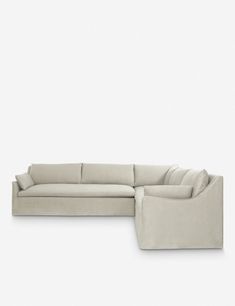 a large sectional couch sitting on top of a white floor