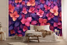 a bedroom with purple and pink flowers on the wall