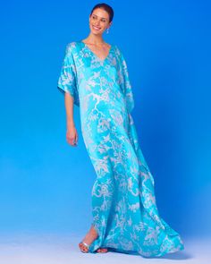 Ava Silk Kaftan in Turquoise and Silver Motif Elegant Blue Floral Print Kimono, Elegant Blue Floral Print Kaftan, Elegant Blue Kimono For Vacation, Spring Blue Silk Kaftan, Blue Silk Kaftan For Spring, Blue Silk V-neck Kaftan, Blue Kaftan For Spring Evening, Blue Kaftan For Evening In Spring, Blue Evening Kaftan For Spring