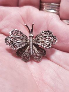 925 Sterling Silver, Filigree Garden Butterfly, Brooch or Pin, Antique Estate Jewelry, Wedding Jewelry, Something Old This is a nice find and priced to sell. Very decorative and collectible. This measures 2.10 inches wide and 1.90 inches tall. As shop owners we will do our best to describe any issues or problems with our items. Since we do sell vintage and antiques there may be some flaws. Please check out the pictures very carefully and feel free to ask any questions. All sales are final. With Garden Butterfly, Butterfly Brooch, Sterling Silver Filigree, Something Old, Jewelry Wedding, Silver Filigree, Estate Jewelry, Makeup Bag, Wedding Jewelry