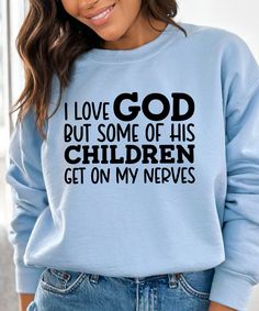 a woman wearing a sweatshirt that says i love god but some of his children get on my