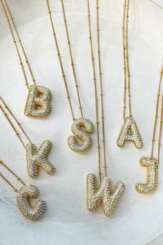 Diamond Bubble Letter Necklace These bubble balloon necklaces are all the rage! All you have to do is choose your letter initial. NECKLACE : Great quality Stainless Steel chain with heavy brass coated BUBBLE LETTER Approx 18" with 2" Extender Sugar Boutique - ships from Shawnee, KS Family run boutique - ❤ Shipping and return info - https://www.sugarboutiquekc.com/pages/shipping-returns Bubble Letter Necklace, Balloon Necklace, Charm Bar, Creek House, Bubble Letter, Cute Ear Piercings, Letter Jewelry, Bubble Necklaces, Bubble Balloons