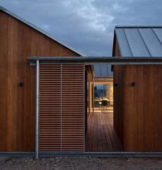 a house with wooden siding and metal roof