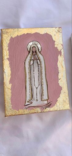 an image of the virgin mary in pink and gold on a white background with yellow border