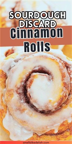 a close up of cinnamon rolls on a plate with the title text sourdough discard cinnamon rolls