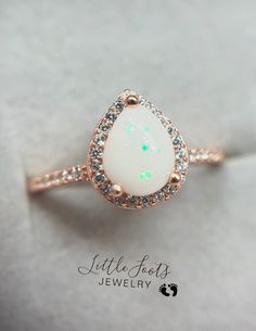 Breastmilk with Opal Shaved Ice Flakes Hypoallergenic White Jewelry For Anniversary, Elegant Teardrop Opal Ring Gift, Gift White Opal Gemstone Ring, Elegant Teardrop Opal Ring As Gift, White Opal Ring Gift, Opal Halo Jewelry As Gift, Opal Jewelry With Halo Setting For Gift, White Opal Birthstone Jewelry, Dainty White Opal Jewelry