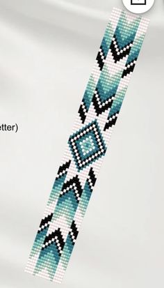 a cross stitch bracelet pattern on white fabric with blue and black squares in the center