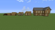 some small wooden houses sitting in the middle of a field