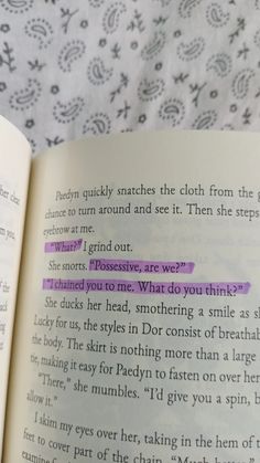 an open book with purple text on it