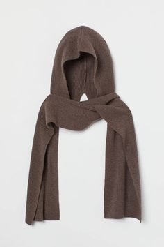 a brown scarf is shown against a white background and it's folded in half