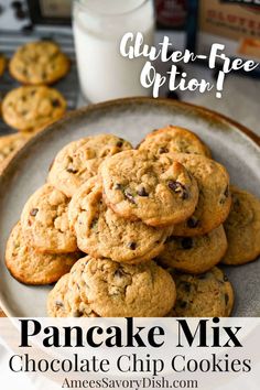 chocolate chip cookies stacked on top of each other in front of a glass of milk