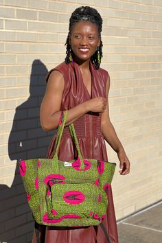 The bag that fits everything and is just everything! The Everything Bag fits all of your essentials stylishly. Handmade in Ghana from authentic Ankara. Disclaimer: Product color and quality seen may vary slightly compared to actual items due to photography lighting conditions and items being one-of-a-kind and cut from different parts of the fabric. Green Travel Shoulder Bag, Casual Green Travel Bag With Removable Pouch, Trendy Tote Travel Bag With Zipper Pocket, Trendy Travel Tote Bag With Removable Pouch, Trendy Weekender Bag With Removable Pouch, Trendy Weekender Shoulder Bag With Removable Pouch, Green Large Capacity Shoulder Travel Bag, Large Capacity Green Shoulder Travel Bag, Green Double Handle Travel Bag For On-the-go