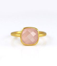 This beautiful stackable bezel set ring is made with cushion shape faceted Pink Chalcedony gemstone in 18K Vermeil Gold. The ring has a 925 stamp. Gemstone size is 10 mm. Please specify your size at checkout. Since I use natural gemstones, the stones may vary slightly in color and shape. This ring is available in three finishes: ✦ 18K VERMEIL GOLD ✦ BRIGHT STERLING SILVER ✦ OXIDIZED (BLACKENED) STERLING SILVER. Please leave me a note at checkout which finish you prefer. Ring will be shipped in D Square Gemstone Ring As Gift, Square Gemstone Ring For Gift, Square Gemstone Promise Ring, Modern Cushion Cut Rings For Gift, Minimalist Cushion Cut Ring As Gift, Rectangular Faceted Ring As A Gift, Adjustable Ring With Rectangular Stone For Gift, Gift Square Cut Birthstone Ring, Adjustable Square Ring For Gift