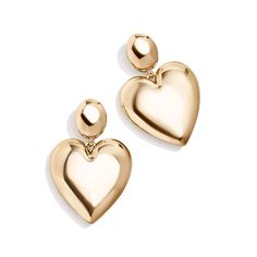 PRICES MAY VARY. Chic, Elegant Design - Featuring a simple stud connected to an oversized, glossy and chunky gold heart drop, these earrings add a modern twist to the classic heart earrings and are perfect for any occasion. Trendy, Versatile Style - Perfect for date night, ladies' night, or any other occasion. The Sheri Earrings are a versatile accessory that can elevate any outfit. Hypoallergenic Material - Made with hypoallergenic materials, these earrings are perfect for those with sensitive Gold Heart Earring, Ladies Night, Classic Gold, Gold Heart, Gold Earrings Studs, Gold Studs, Heart Of Gold, Versatile Style, Heart Earrings