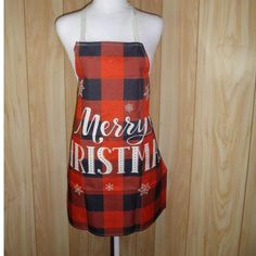 a mannequin wearing an apron that says merry christmas