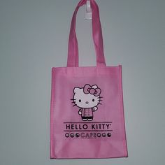 Brand New Hello Kitty Cafe Truck Tote Bag. One Bag. (I Have More If You Want To Bundle) Pink With White Sides. Made From A Tyvek Type Material, So It's Probably Water Repellent. Handles Are Folded Into The Bag, So They're Creased. Comes With A Free Pin And Sticker! Bundle With Something Else In My Closet To Get A 30% Off Discount! Sanrio Food Truck Cute Kawaii Black Pink Sprinkles Rainbow Character Caf Japan Japanese Adorable Small 8x10 Purse Shopper Treat Baggie Collectible Cute Small Pink Bag, Kawaii Hello Kitty Print Rectangular Bag, Cute Hello Kitty Rectangular Shoulder Bag, Small Cute Bags For Gifts, Cute Small Bags For Gifts, Hello Kitty Print Rectangular Shoulder Bag Gift, Hello Kitty Print School Pouch Bag, Rectangular Hello Kitty Shoulder Bag Gift, Rectangular Hello Kitty Print Shoulder Bag Gift