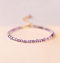 🎇✨ D E S C R I P T I O N ✨🎇 💎 Stones used: Natural amethyst  📏 Bead size: 2.5mm 📏 Bracelet length: One side, with a total length of 150 mm, and comes with a 50 mm extension chain, allowing the length to be adjusted freely. 💎 Embrace Serenity with Our Handcrafted Amethyst Bracelet Discover the calming beauty of our Handcrafted Amethyst Bracelet, designed to bring you peace and positivity. Made from natural amethyst stones, this bracelet is not only a stunning accessory but also a powerful t Amethyst Crystal Bracelet Gift, Adjustable Lavender Jewelry For Everyday, Minimalist Purple Bracelet For Everyday Wear, Minimalist Purple Bracelet For Everyday, Minimalist Purple Everyday Bracelet, Dainty Handmade Amethyst Bracelets, Dainty Handmade Purple Bracelets, Dainty Amethyst Adjustable Bracelets, Adjustable Dainty Amethyst Bracelets