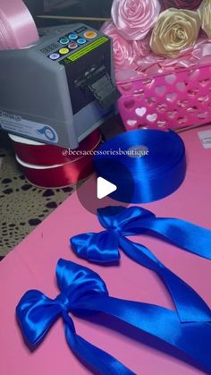 the ribbon is being used to make bows for cakes and cupcakes, as well as other decorations