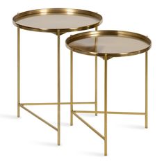 two tables with gold metal frames and glass top, one on each side is holding a tray