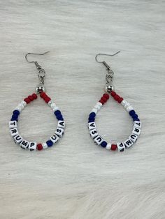 Hi everyone 😊 You are looking at another pair of Pretty Earrings by Audrey, all handmade with love. Handmade Earrings, Red, White, Blue, Small Beads, White, Black Letter Square Beads, Silver, Gold Beads,  Hoop Dangle Earrings. This pair is 3 inches long from top to bottom. And about 1.5 inches wide. Thank you for looking at my handmade jewelry Letter Earrings, Square Bead, Black Letter, Pretty Earrings, Gold Beads, Handmade Earrings, Jewelry Earrings Dangle, Dangle Drop Earrings, Dangle Earrings