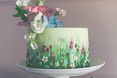 there is a cake decorated with flowers on it