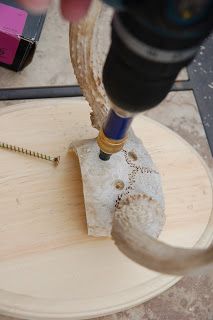 a drill is being used to fix a piece of wood