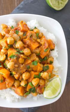 a white plate topped with rice and chickpeas